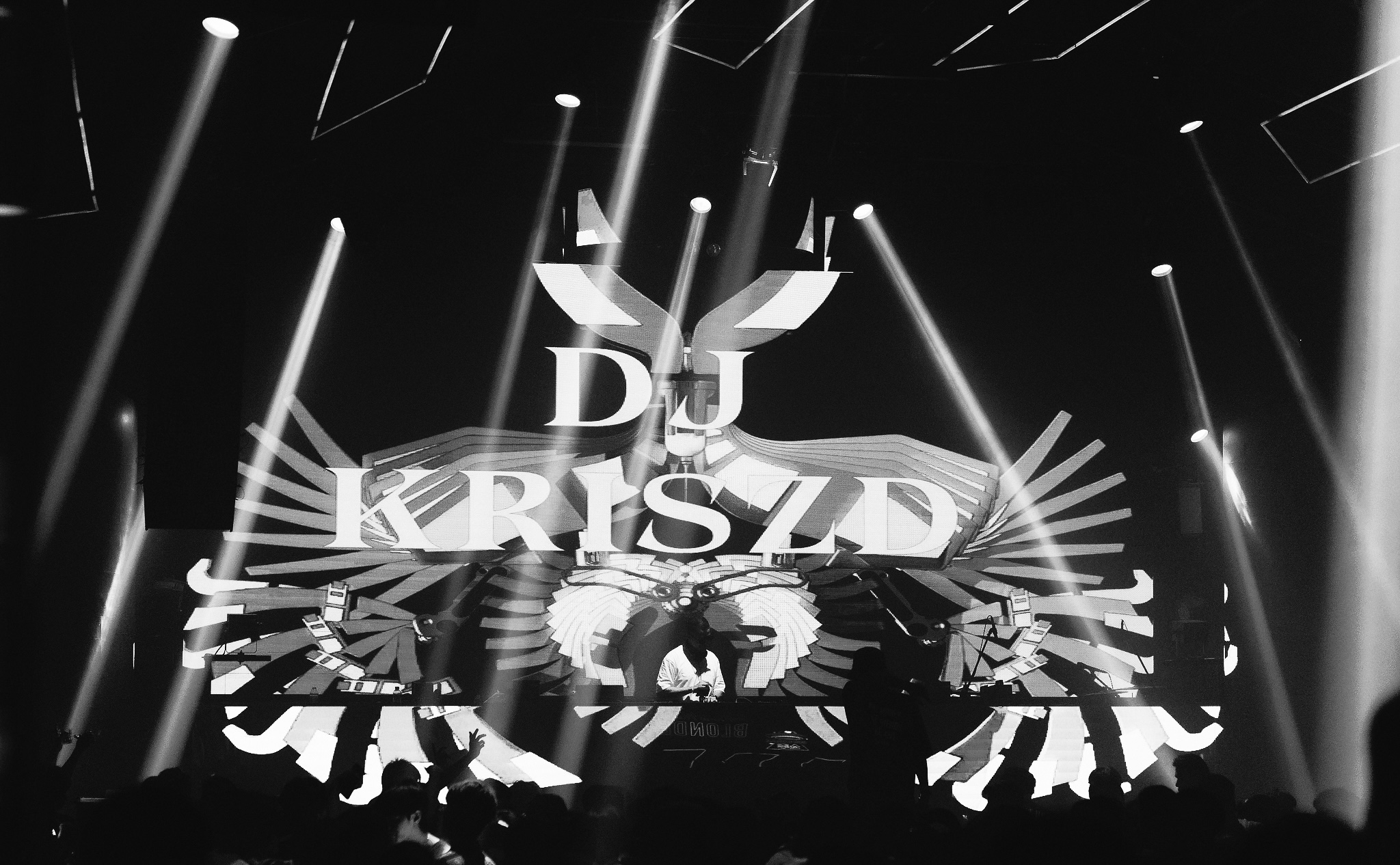 DJ Kriszd performing live behind the decks